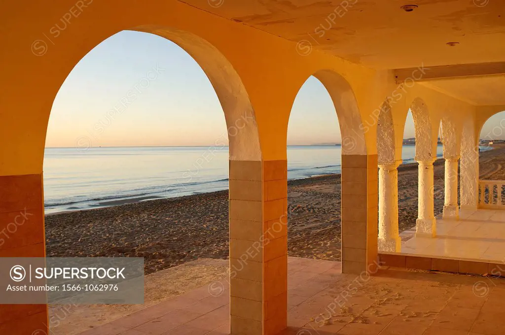 arch of houses at Santa Pola beach, Salinas de Santa Pola Nature Reserve, Santa Pola, Alicante, Spain