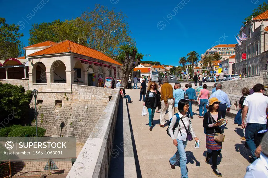 People walking through Pile Gate outside Grad the old town Dubrovnik city Dalmatia Croatia Europe