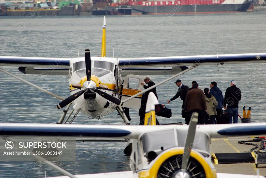 Passengers boarding a hydroplane heading to Victoria in Coal Harbour, Vancouver, Canada