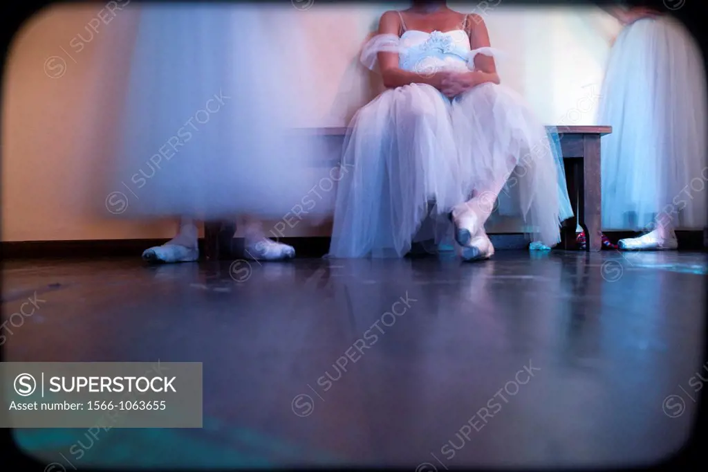 Resting during a classical ballet performance in theater,