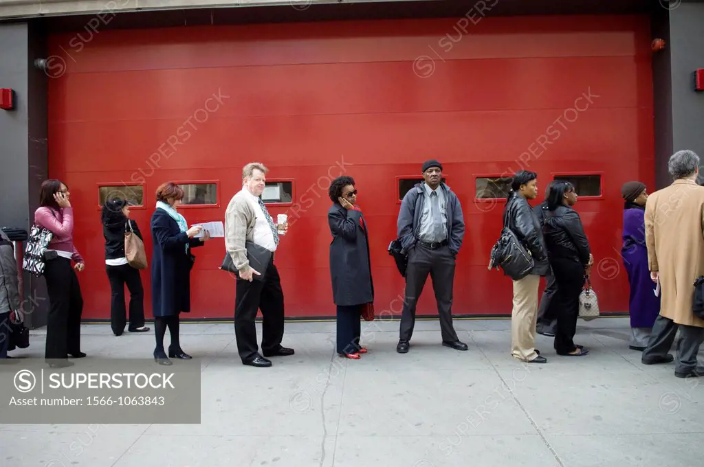 Job seekers line up for a job fair in midtown in New York