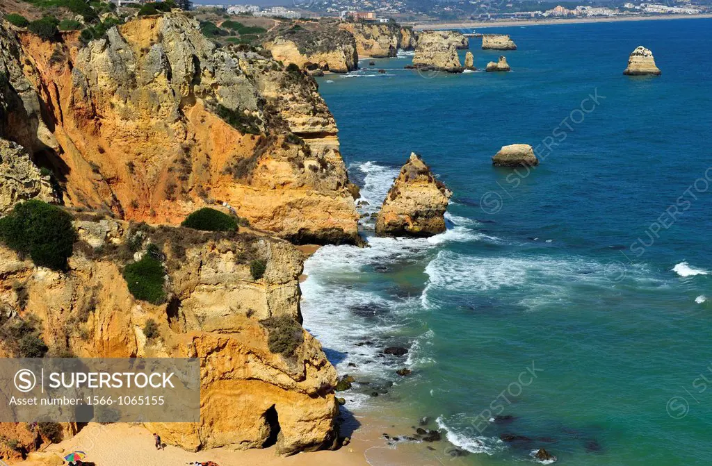 Europa,Southwestern Europe,the Portuguese Coast in Algarve,a sunny beach located between the sandstone cliffs of Ponta da Piedade near Lagos,Portugal