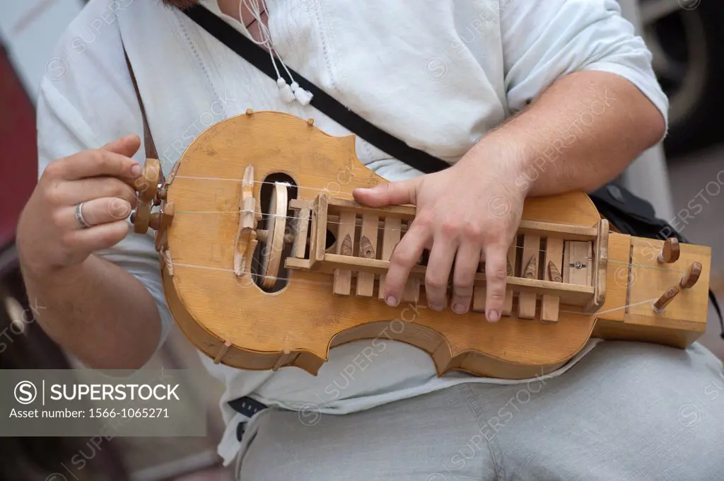 A man plays a Lira, a traditional Russian musical instrument, Kiev, Ukraine, Europe