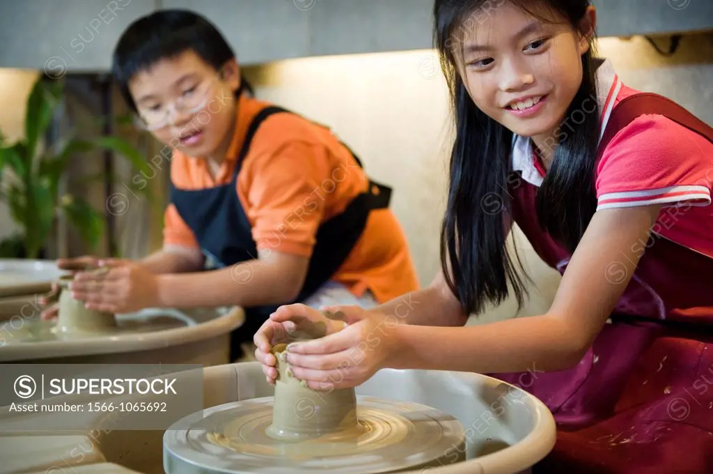 Taiwanese kids taking part in a pottery making class, an industry that has flourished in the region