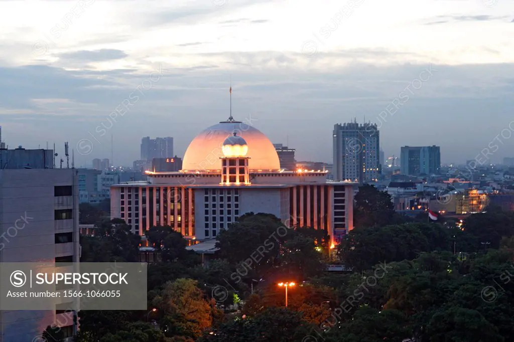 Istiqlal mosque of Jakarta at dawn with city lights, Indonesia, Southeast Asia