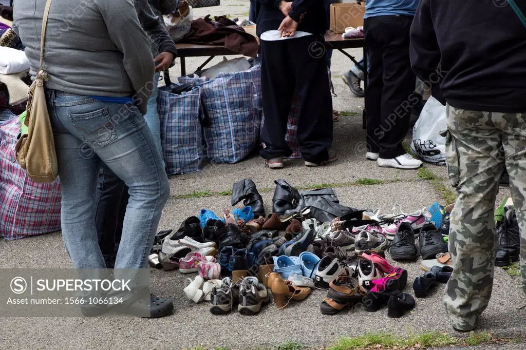 Detroit, Michigan - Volunteers from United Christians in Christ church distribute clothing and shoes to homeless people in Cass Park