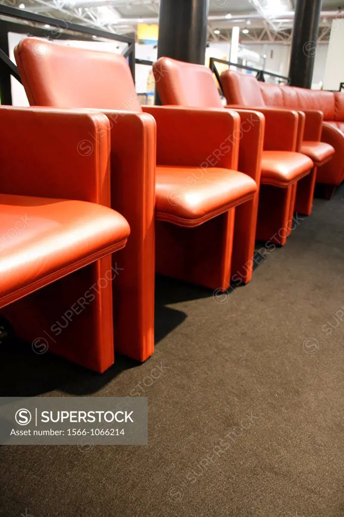 rows of modern leather chairs for vip at an indoor parade event