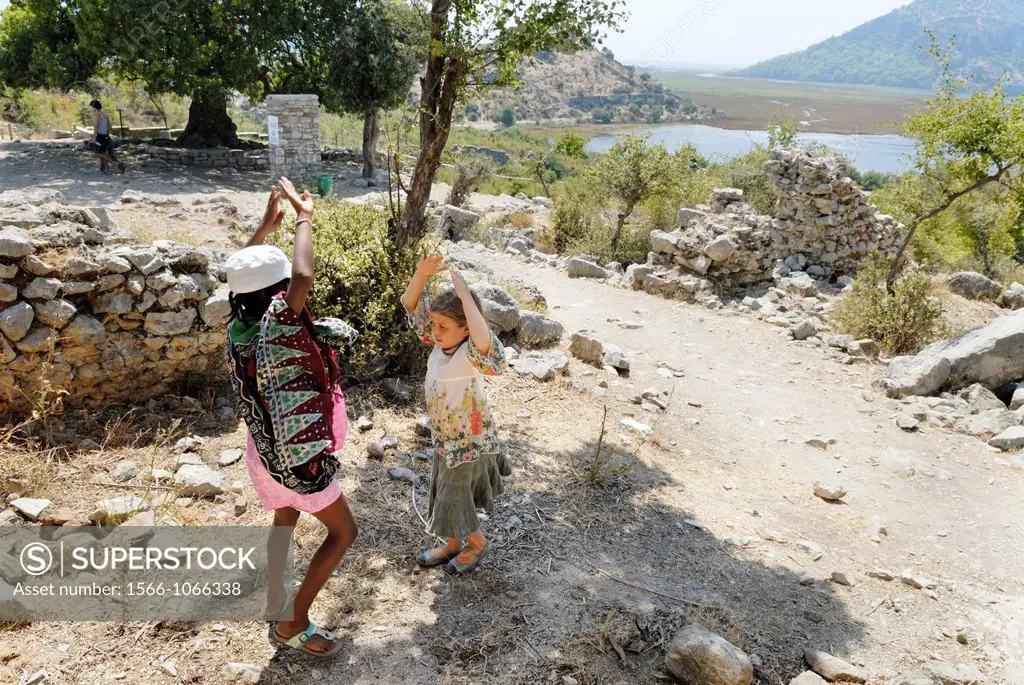 little girls playing at the Caunos archeological site, Dalyan, Turkey, Eurasia