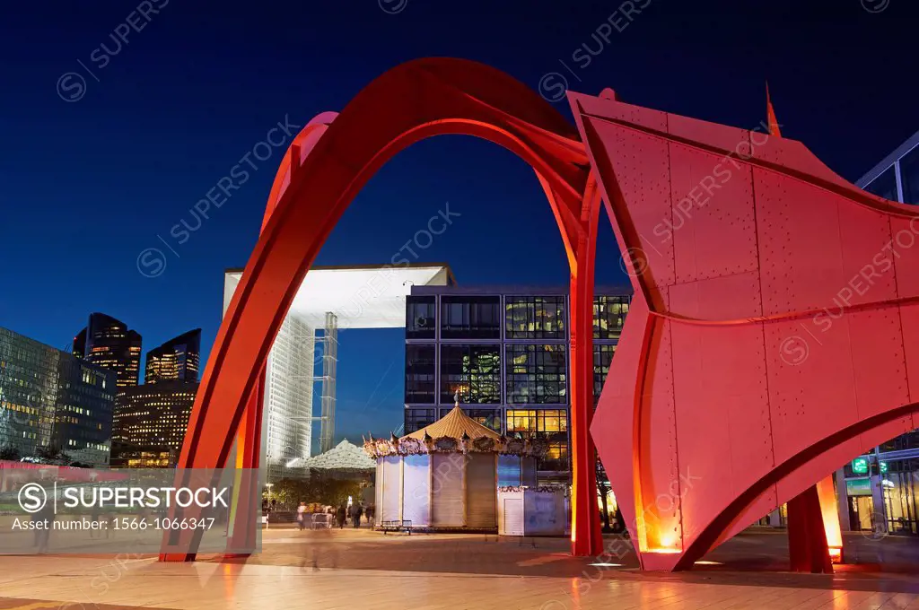 France, Paris, La Grande Arche de la Defense by architect Otto Von Spreckelsen and sculpture by Calder called The Red Spider on the esplanad at night