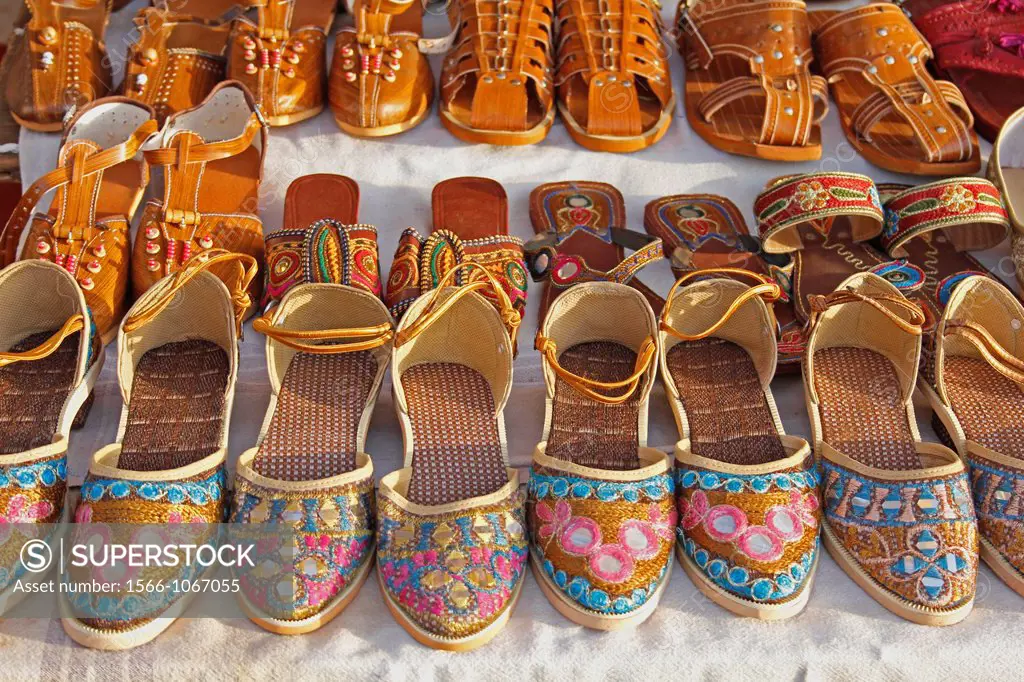 Typical Kolhapuri style footwear made in pure leather kept for selling at marketplace, pune, Maharashtra, India