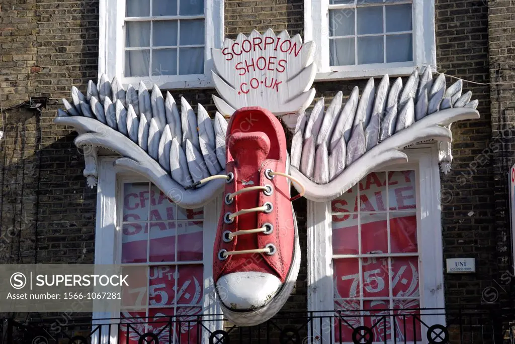 Giant baseball shoe with wings outside a shoe shop, Camden Town, London, England