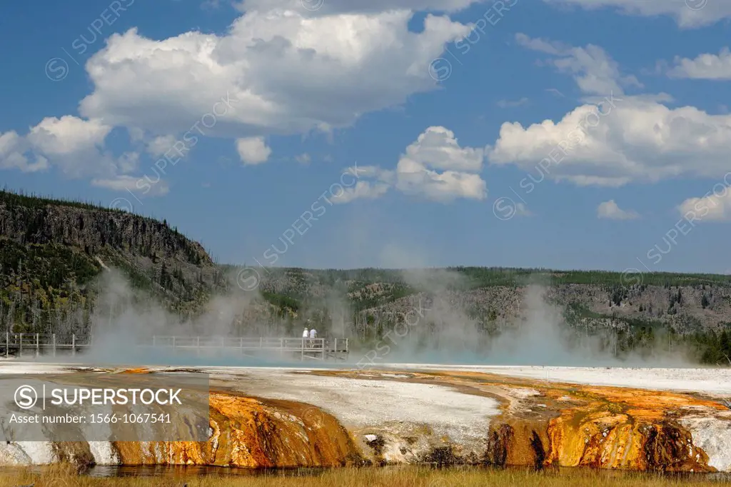Tourists walking boardwalks at thermal features attractions, Yellowstone NP, Wyoming, USA