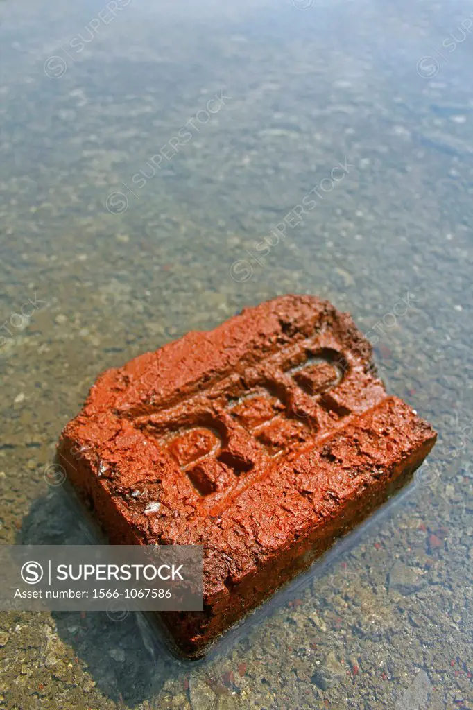 brick in water