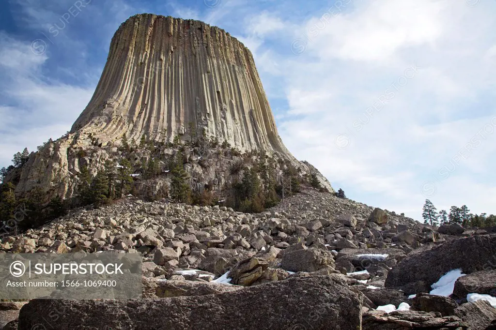 Hulett, Wyoming - Devils Tower National Monument  The volanic tower rises 1200 feet above the surrounding plains  A boulder field with fallen rock and...