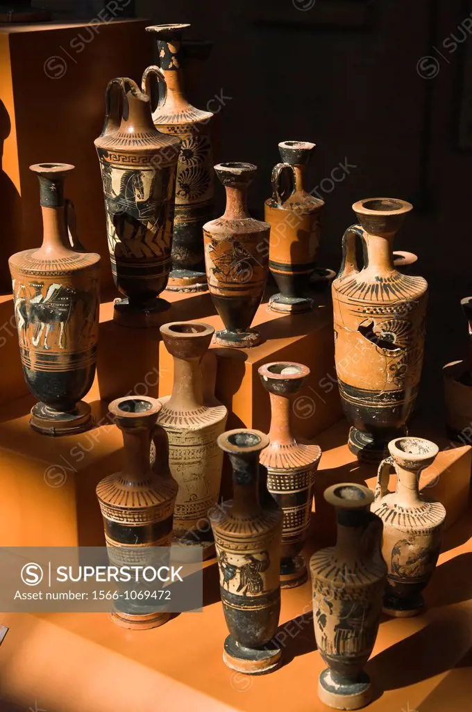 A museum display of lekythoi, oil flasks, from the 5th cen BC, discovered in graves at Ancient Corinth, Peloponnese, Greece