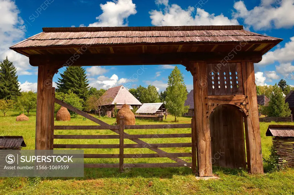 19th century traditional farm house & gate of the Iza Valley, The Village museum near Sighlet, Maramures, Northern Transylvania
