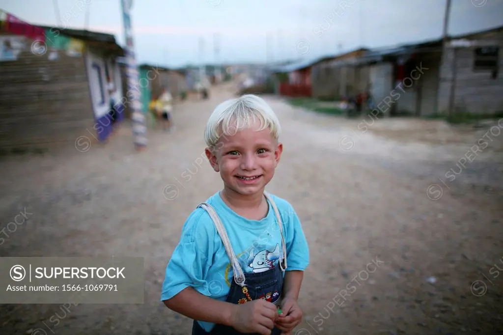 Portrait of a displaced boy in the slums of Colombia