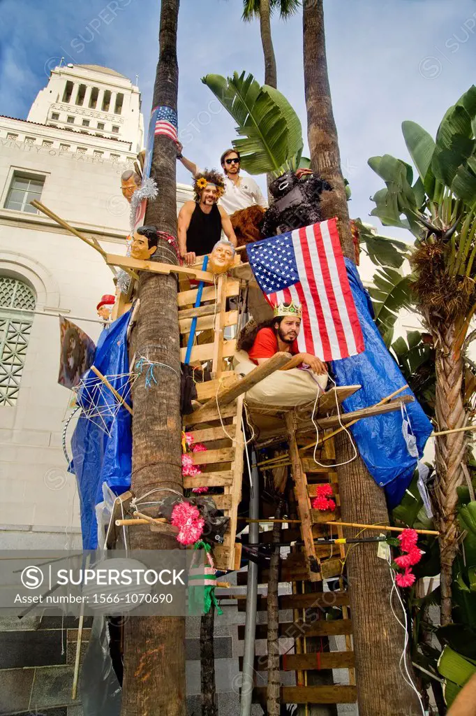 Occupy Wall Street protesters build a tree house at Los Angeles City Hall during their occupation in October, 2011  Note signs