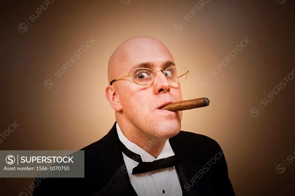 Middle-age bald man in a tuxedo, smoking a cigar