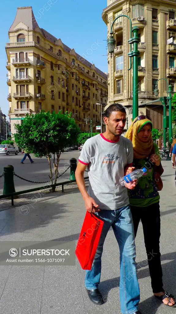 Street scene with young couple, Cairo, Egypt
