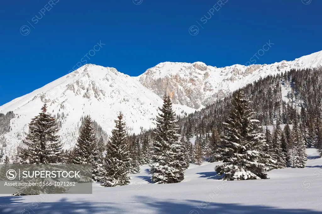 Valley Gaistal with snow during deep winter in Tyrol, Austria View towards the mountain crest of the Wetterstein Mountain range with the peak of Klein...