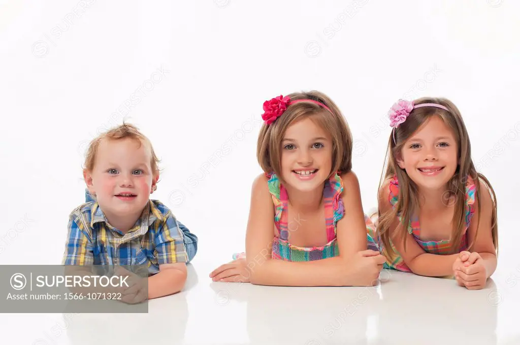 Portrait of three happy children