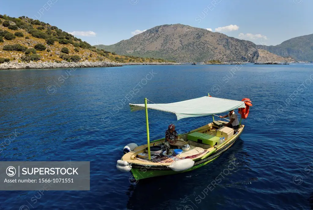 pancakes gozleme saleswoman with a boat, Lycian coast, Turkey, Eurasia