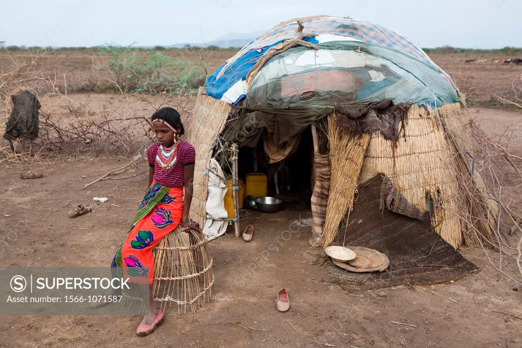 The Afari Northern Etiopie were originally nomads and live in very primitive huts made of straw, twigs and a piece of plastic living conditions are ha...