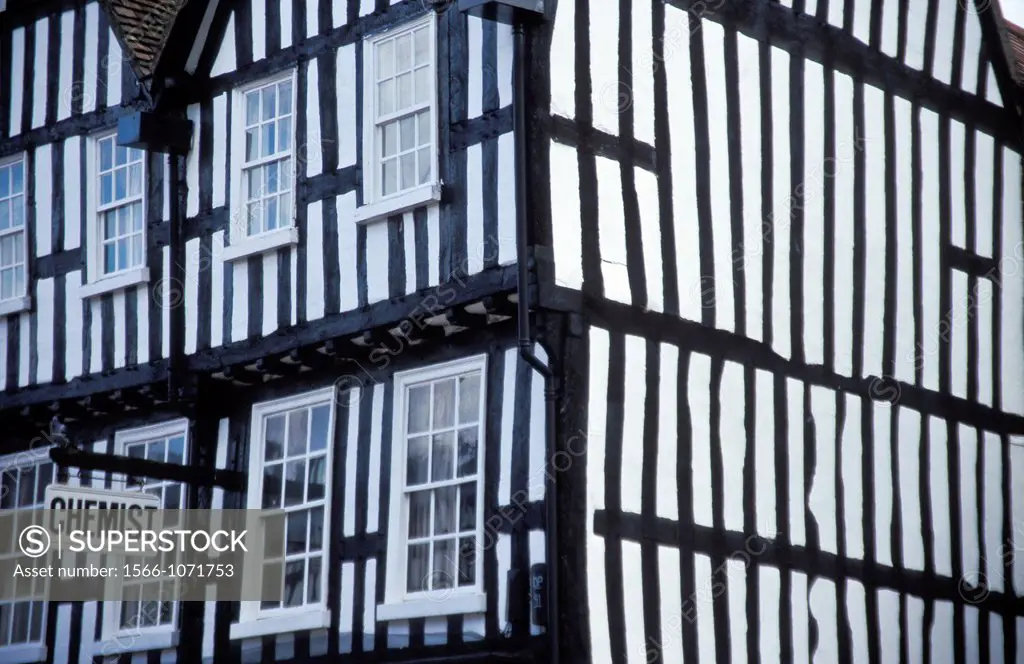 Corner of a Tudor house with sign for Chemist, Stratford upon Avon, Warwickshire, England