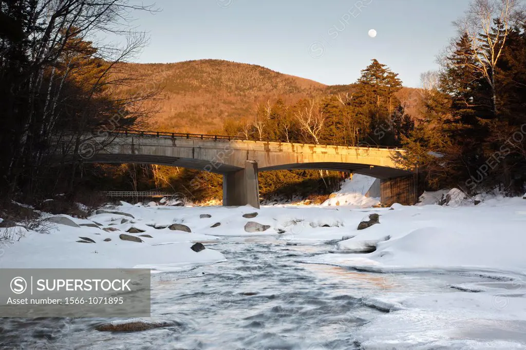 Road Bridge during the in winter months  This bridge crosses the East Branch of the Pemigewasset River in Lincoln, New Hampshire USA along Kancamagus ...