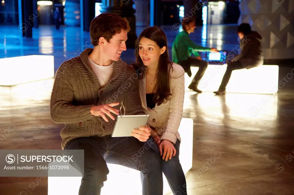 Young couple with digital tablet, digital tablet, Alhondiga building, leisure and culture center, Bilbao, Bizkaia, Basque Country, Spain