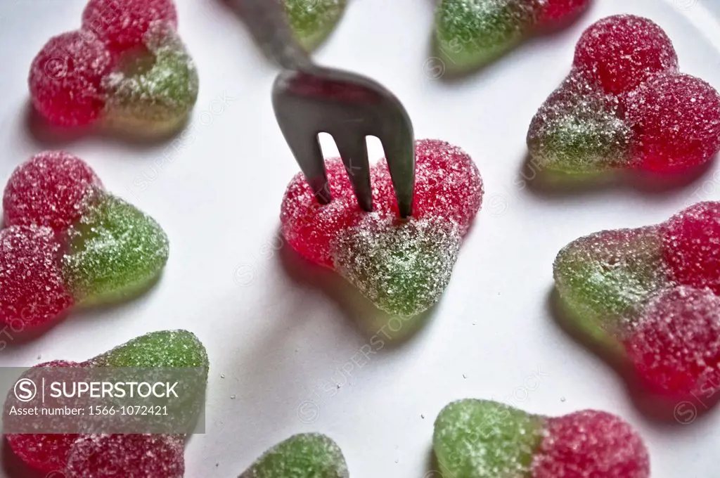 Fork stabbing a heart-shaped sweet