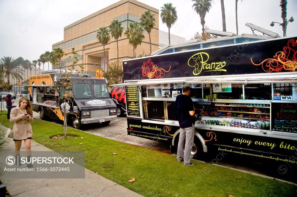 Gourmet food vans serve noontime lunch on Wilshire Boulevard, Los Angeles  In background is the Los Angeles County Museum of Art