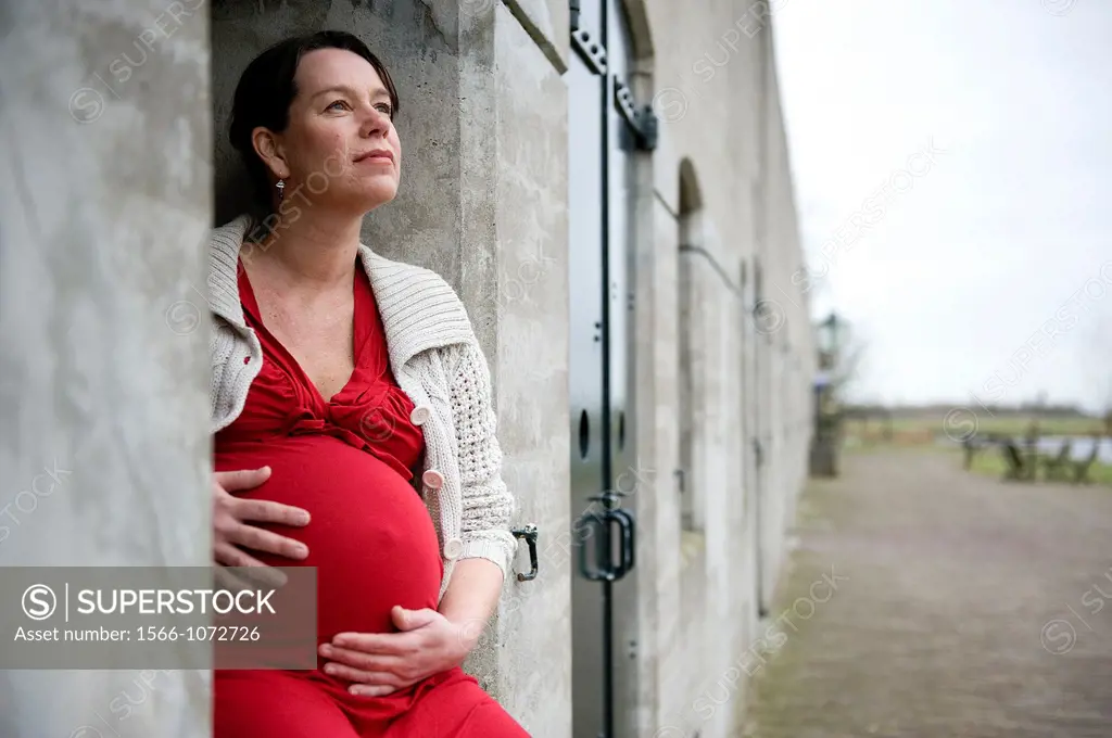 Hoofddorp, Netherlands. Middle-aged woman, expecting her first child, after being pregnant for 38 weeks.