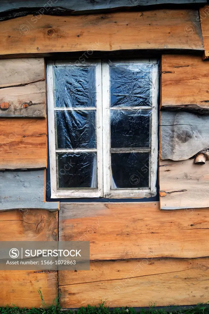 Window in wooden slab house, Paimun, Parque Nacional Lanin, Neuquen, Argentina