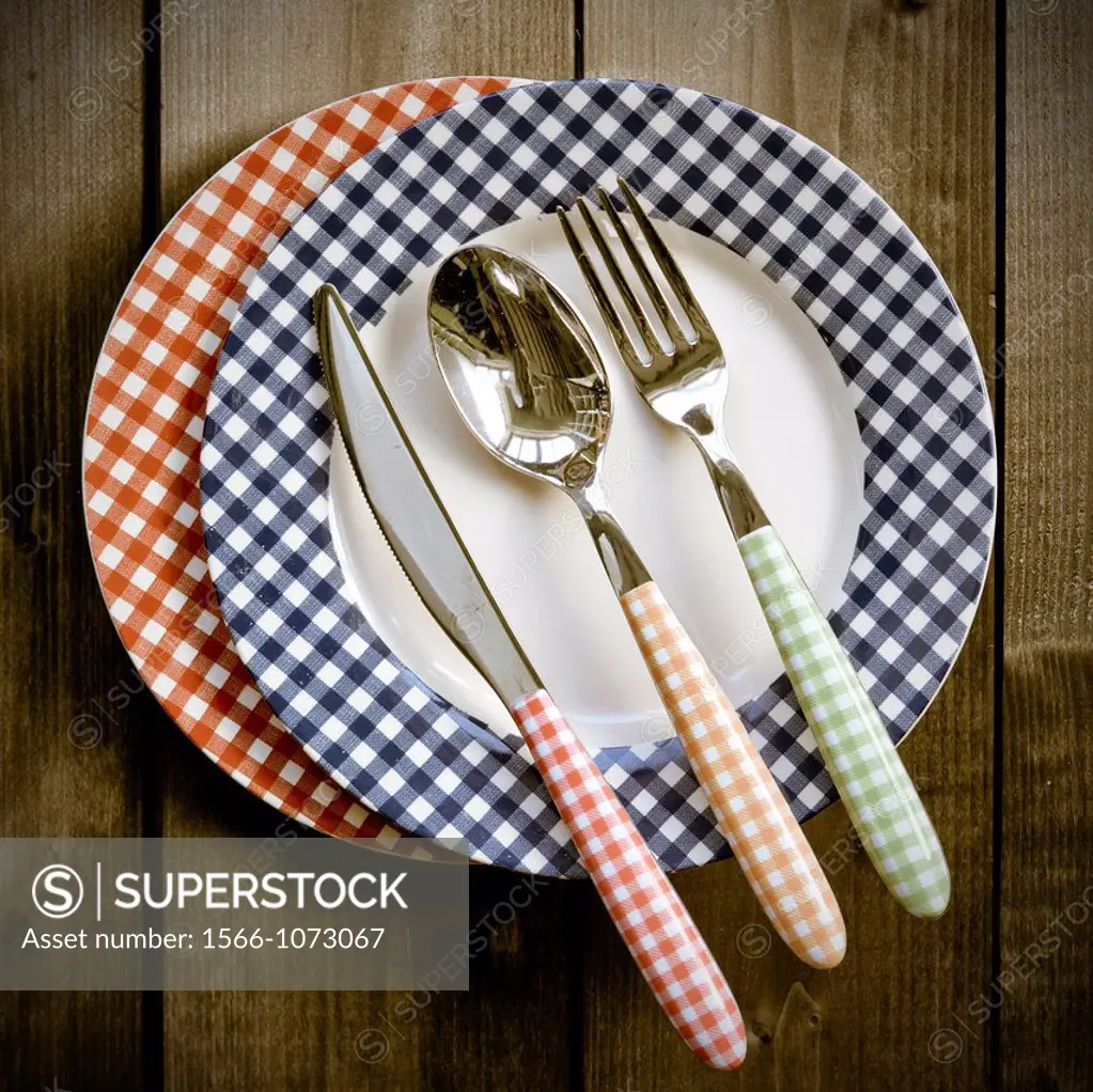 colorful, peasant dishes with colorful cutlery