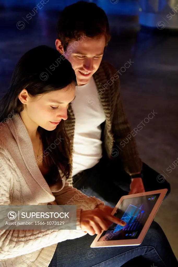 Young couple with digital tablet, digital tablet, Alhondiga building, leisure and culture center, Bilbao, Bizkaia, Basque Country, Spain