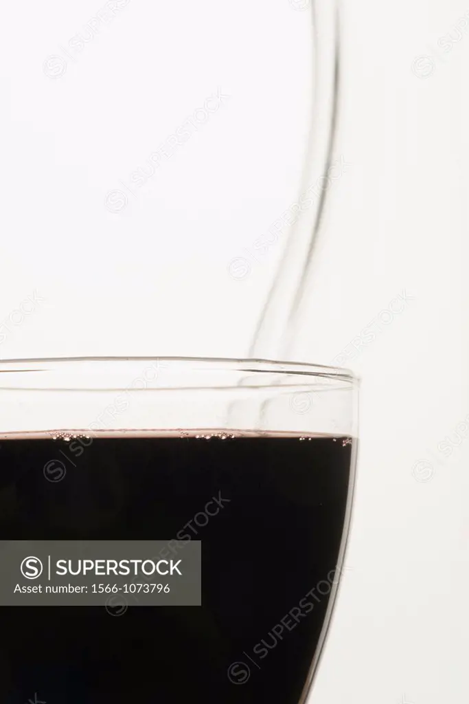 Extreme close up of a full glass of red wine