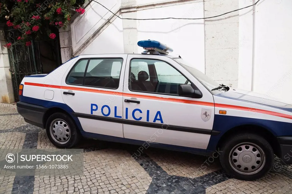 Parked police car on a city street in Cascais, Portugal, Europe