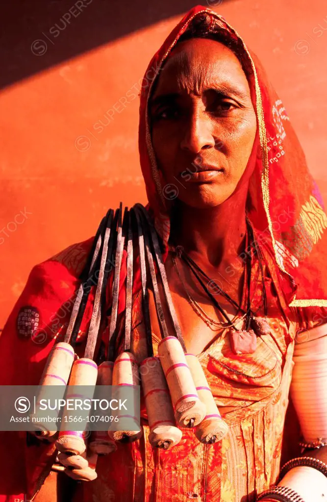 Blacksmith woman selling sickles. She belongs to an untouchable community, the Gaduliya lohar. From Pushkar, India.