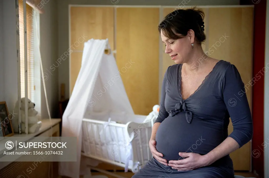 Middel-aged woman, expecting her first child, after being pregnant for 38 weeks.