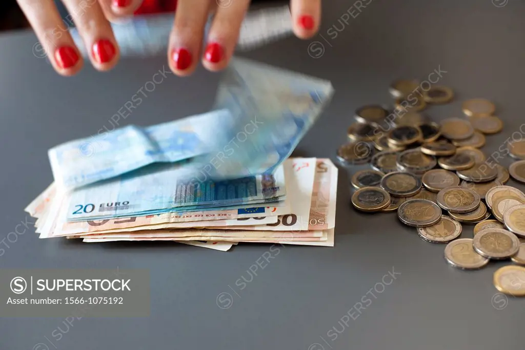 young woman hands counting euros