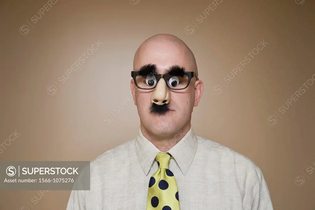 Middle-age bald man wearing funny glasses