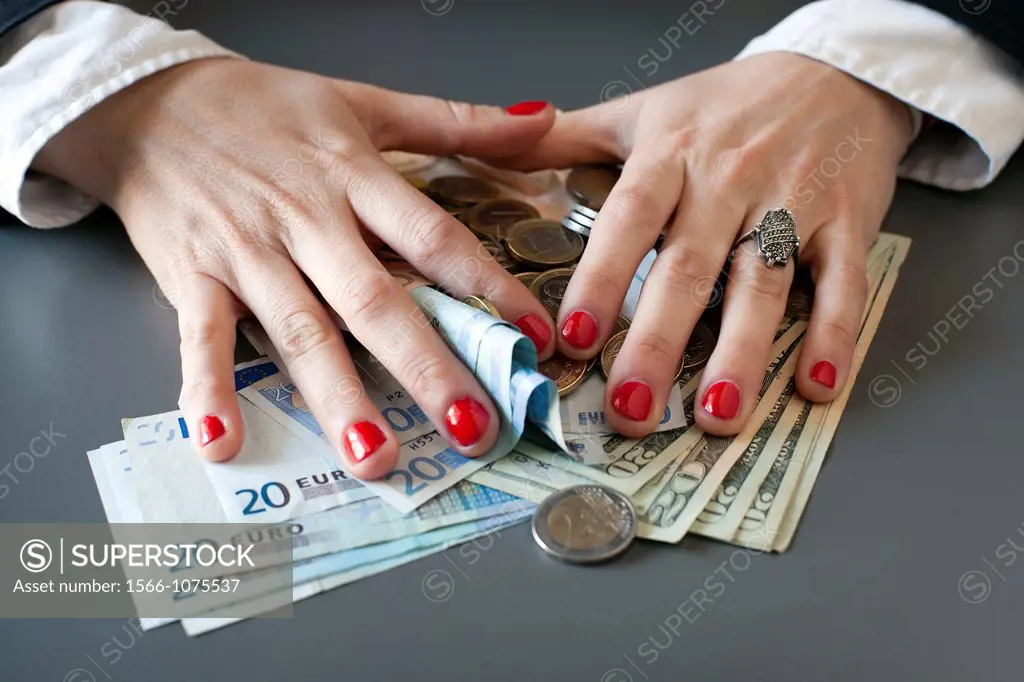 young woman hands counting euros and dollars