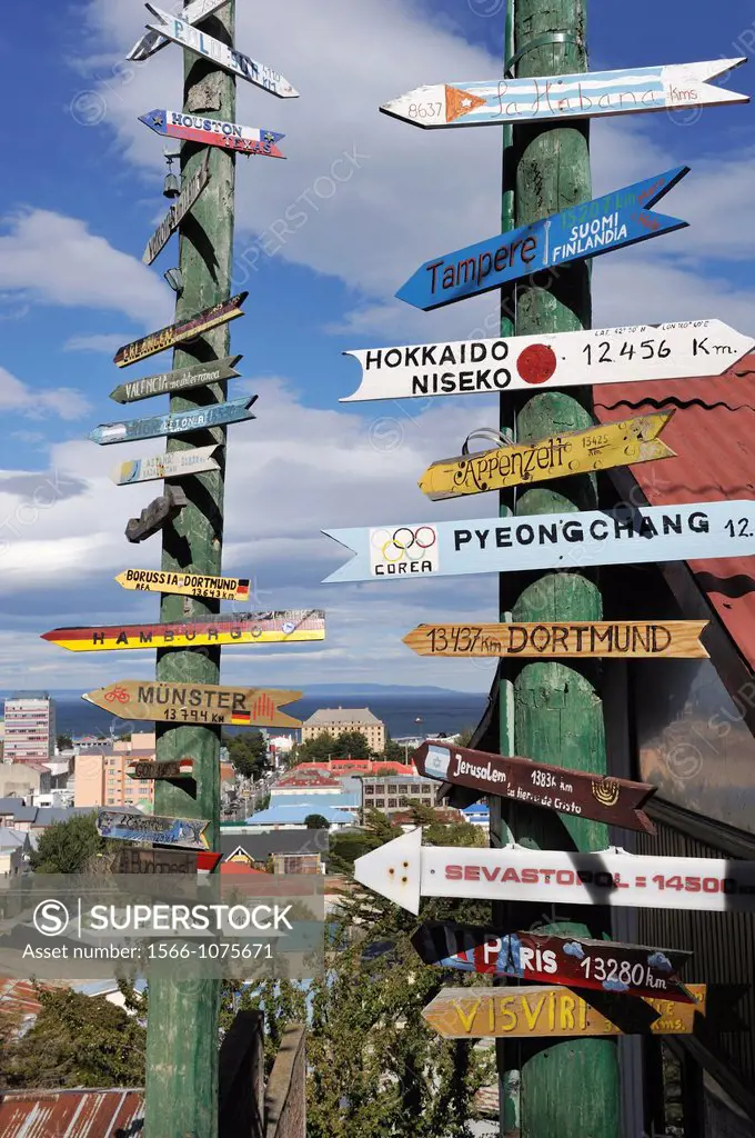 sign post showing distance of some cities over the world from Punta Arenas, Strait of Magellan, Peninsula of Brunswick, Chile, South America
