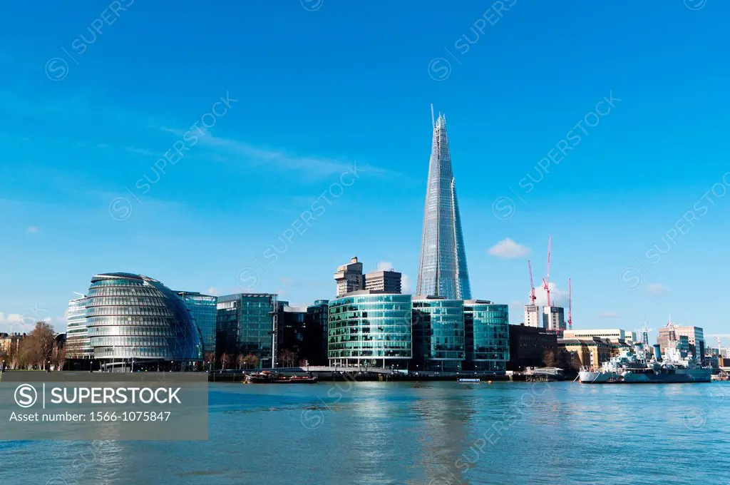 The Shard and City Hall amongst new buildings on the south bank of the river Thames  London