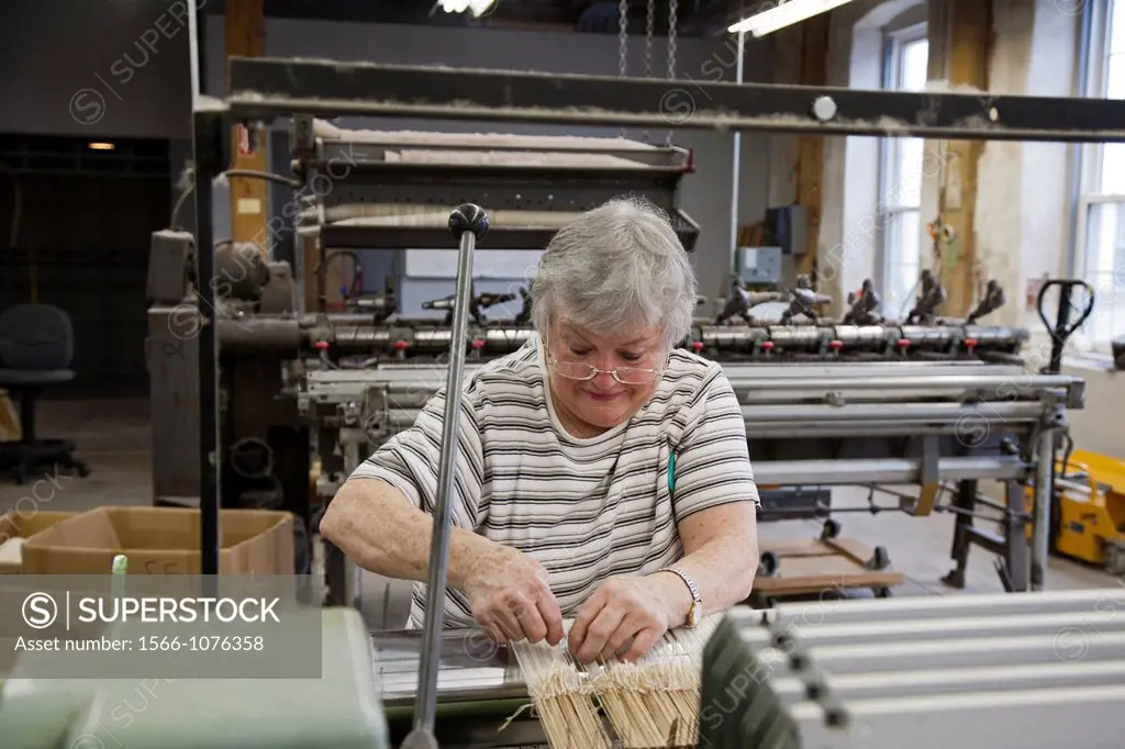 Amana, Iowa - A worker operates a loom at the Amana Woolen Mill  The Woolen Mill is one of the enterprises started when German immigrants established ...