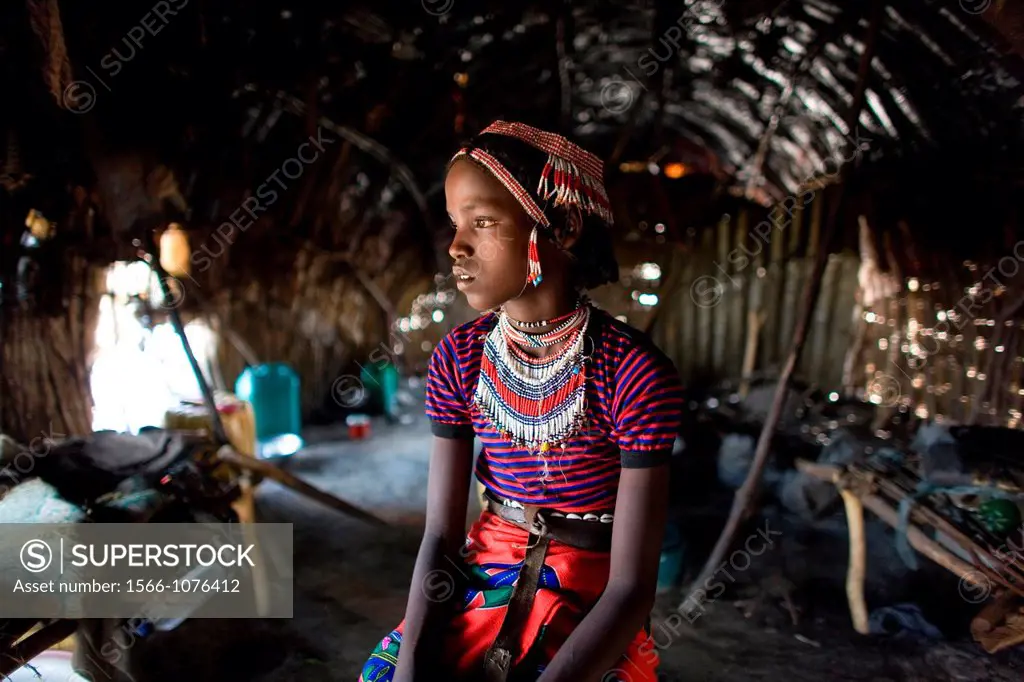 The Afari Northern Etiopie were originally nomads and live in very primitive huts made of straw, twigs and a piece of plastic living conditions are ha...