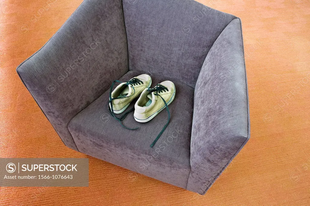 Pair of man´s shoes on a chair
