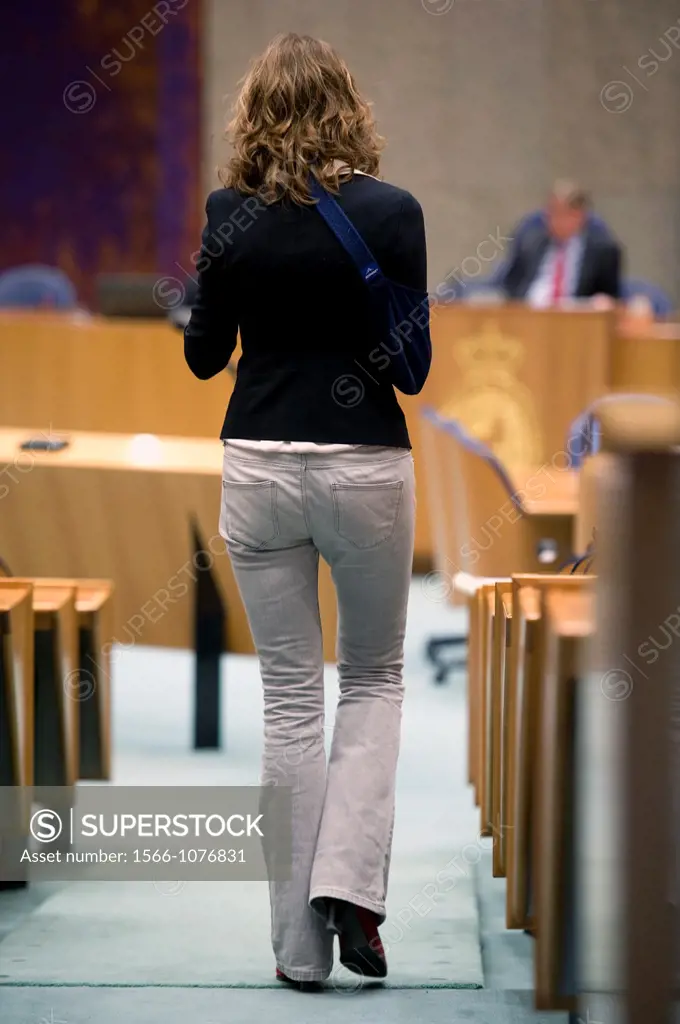 The Hague, Netherlands. Member of Dutch parliament, Sharon Gesthuizen, walking down an aisle, during a debate about procurement-legislation.